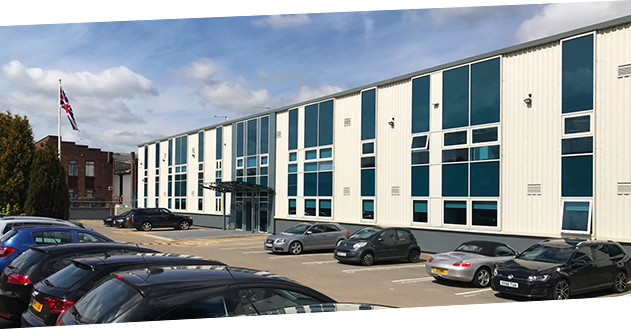 An image of the exterior of Tibbetts House, Banbury, taken from the front-facing car park on a sunny day.