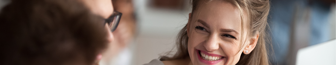 An image of a woman smiling.